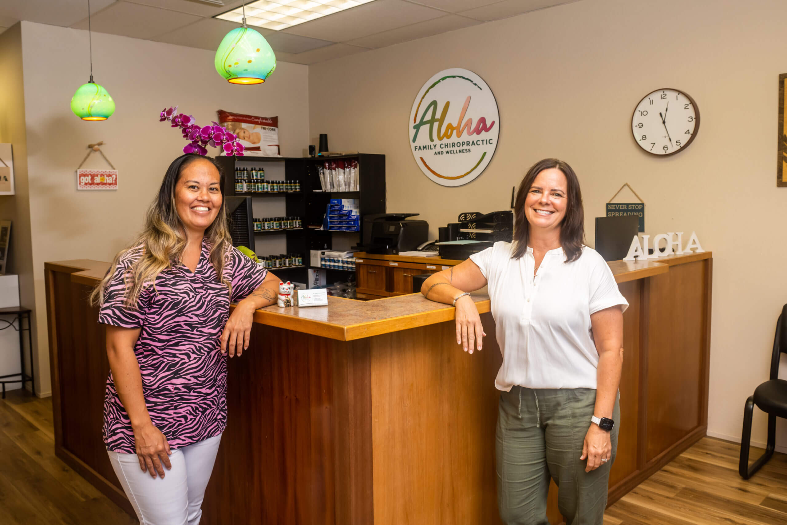 Two Women Standing By A Wooden Counter Space