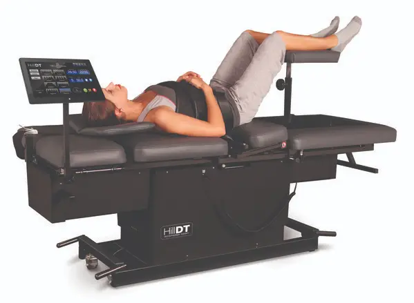 Person on spinal decompression therapy machine.